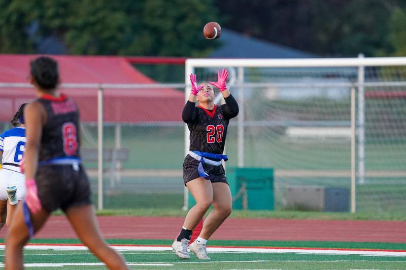 Yorkville's Kayla Kersting (28) receives a pass against Geneva during a non-conference game at Yorkville High School on Tuesday, Sept. 2, 2025.