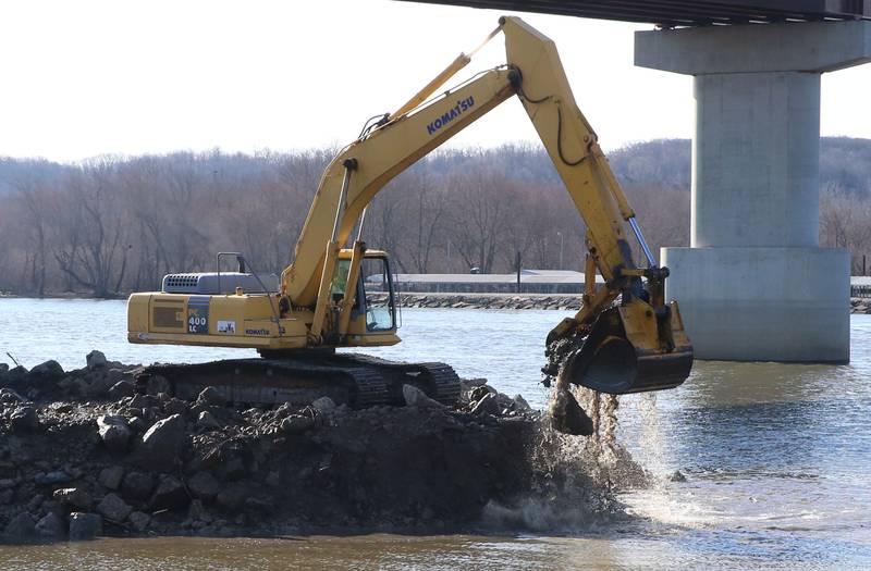 An excavator dredges the harbor at Barto Landing on Wednesday, March 26, 2025 in Spring Valley.