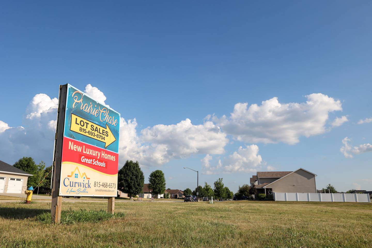 A home-builder advertises at the entrance to a subdivision in Bourbonnais on July 9, 2025. A recent housing study commissioned by the Economic Alliance of Kankakee County found the county needs to annually construct 500-600 housing units to meet the need, but it is not.