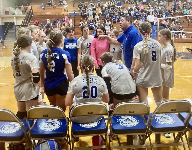 Princeton coach Andy Puck coaches his team up between games after rallying to defeat Bureau Valley 25-21 in the first set of Tuesday's match at Prouty Gym.