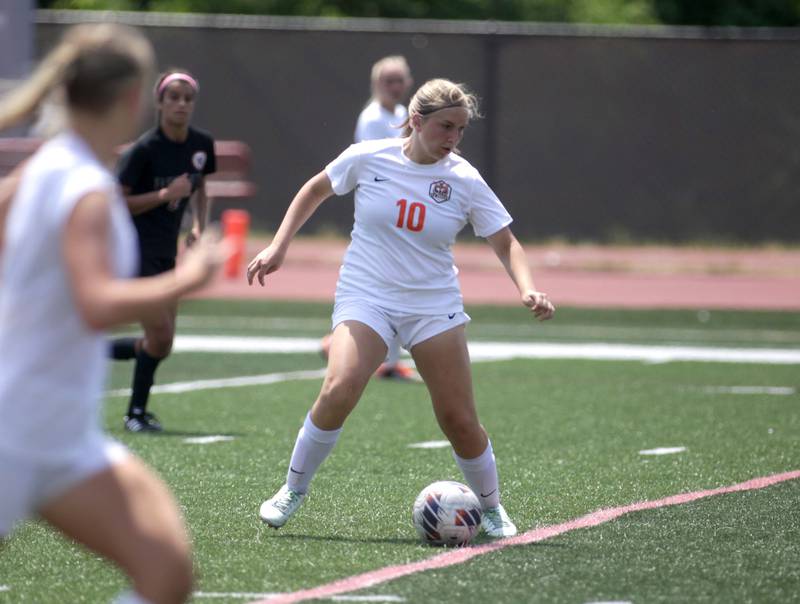 Crystal Lake Central’s Brooklyn Carlson goes after the ball during a Class 2A girls state soccer semifinal against Benet at North Central College in Naperville on Friday, June 2, 2023.