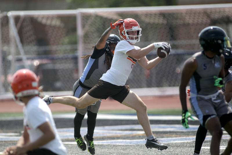 Hersey’s Carson Grove makes a catch during a 7-on-7 football game against Kankakee at St. Charles North on Thursday, June 22, 2023.