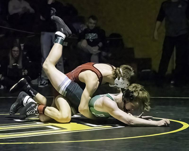 Erie-Prophetstown's Wyatt Goossens (top) controls Rock Falls' Aaron Meenen during the 120-pound title bout at the 1A Riverdale Regional on Saturday, Feb. 4, 2023.