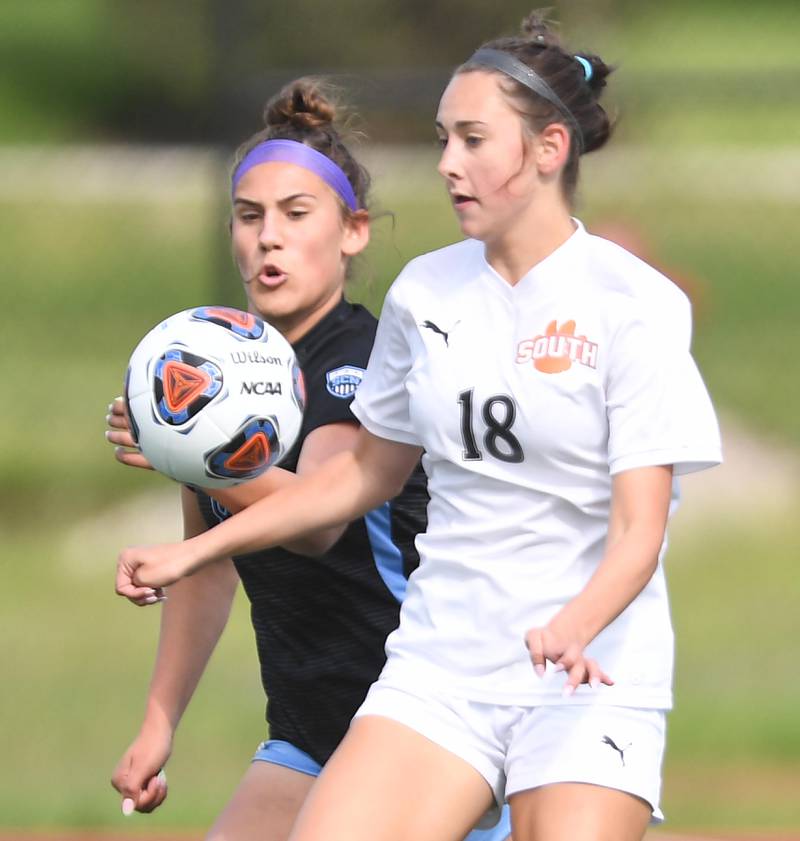 John Starks/jstarks@dailyherald.com
Wheaton Warrenville South’s Ella McClatchy works against St. Charles North’s Sophia Hein in the St. Charles East girls soccer sectional semifinal game on Tuesday, May 24, 2022.