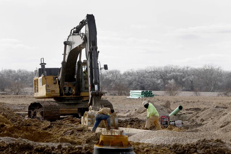 Construction continues on the installing water and sewer lines in the Stonewater subdivision in Wonder Lake on Friday, Feb. 24, 2023. When the subdivision is finished, 3,400 to 3,700 more rooftops will be added to Wonder Lake, potentially making the village one of the larger municipalities in McHenry County.