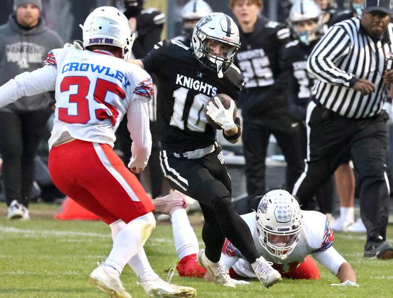 Kaneland's Colton VanDyke tries to illude Lakes’ Mason Crowley Saturday, Nov. 1, 2025, during their first round playoff game at Kaneland High School in Maple Park.
