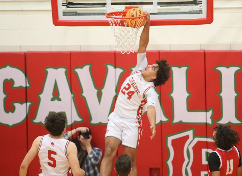 L-P's Marion Persich dunks the ball over Ottawa's Hezekiah Joachim on Friday, Feb. 7, 2025 in Sellett Gymnasium at L-P High School.
