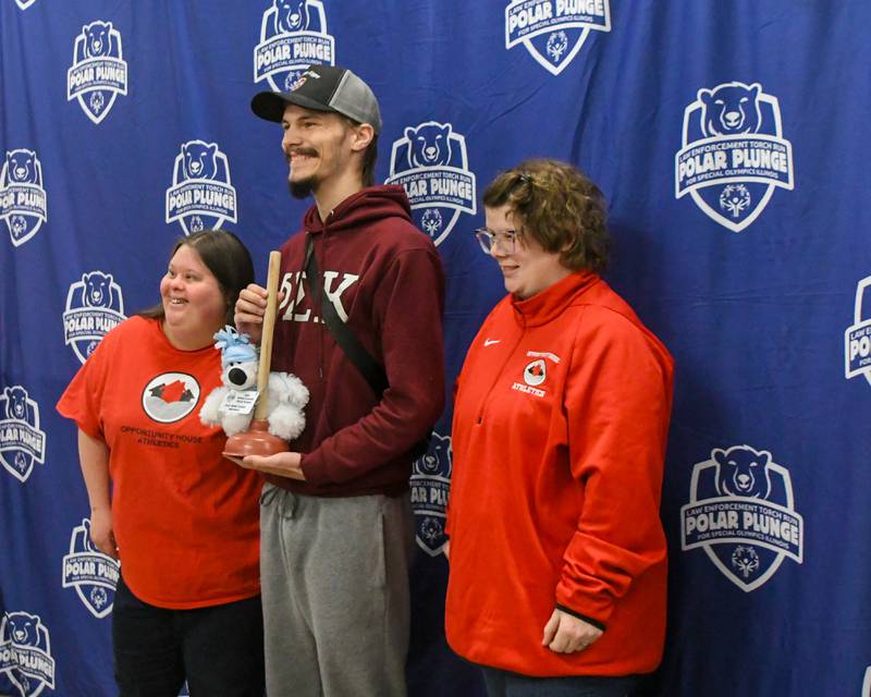 Ryan Kramer poses for a photo with Shelby Edward and Lisa Steinbis who handed Ryan the award for the Most money raised by and individual. Ryan raised $1,000.