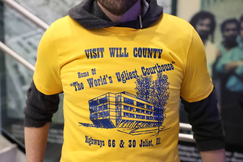 A volunteer wears a “World’s Ugliest Courthouse” tee-shirt at a kegger fundraiser to save the old Will County Courthouse at the Joliet Area Historical Museum on Friday, February 3rd.