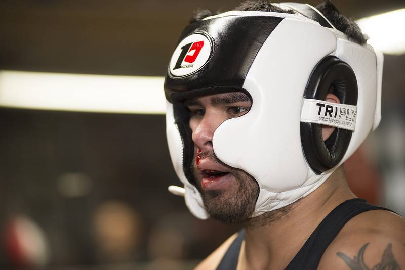 Jose Martinez of Sterling has a bloody nose cleaned up after sparring Wednesday evening in Sterling. Gym owner and trainer Steve Mazzarisi has been running the gym for a couple years now and currently has 14 students of the art.