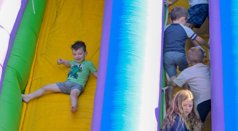 Logan Yackley, 4 of Geneva takes his turns on one of the inflatable slides at the Batavia MainStreet’s Block Party on Sunday, Aug 31, 2025 in Batavia.