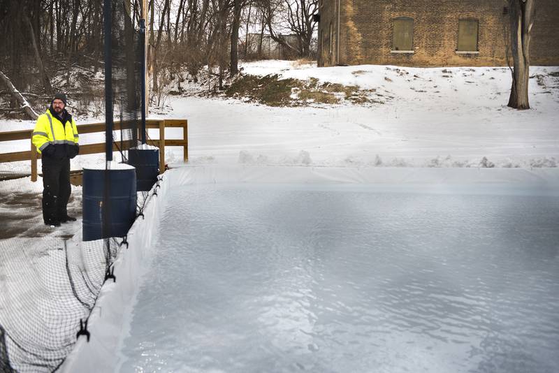 After constructing the base and the liner, workers start to fill the rink with water Tuesday afternoon. Lights, a protective netting, music and a warming shed will all add to the outdoor fun at the Dixon ice rink.