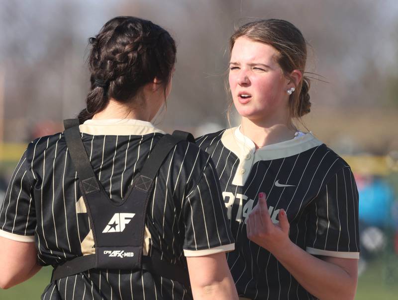 Sycamore pitcher Addison Dierschow and catcher Kairi Lantz meet at the mound Friday, April 11, 2025, during their game against Marengo at Sycamore High School.