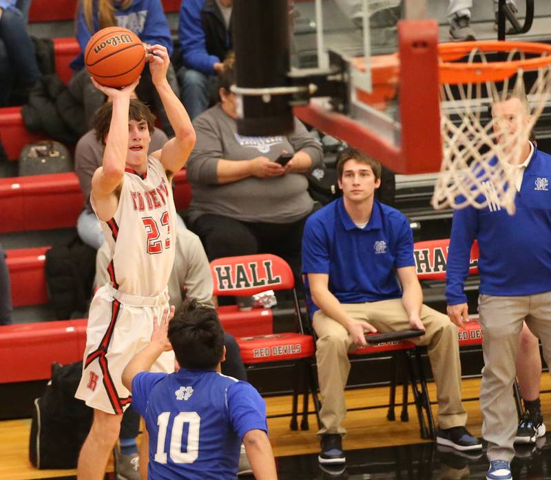 Hall's Braden Curran shoots a shot over Newman's Gabe Padilla on Friday, Feb. 3, 2023 at Hall High School.