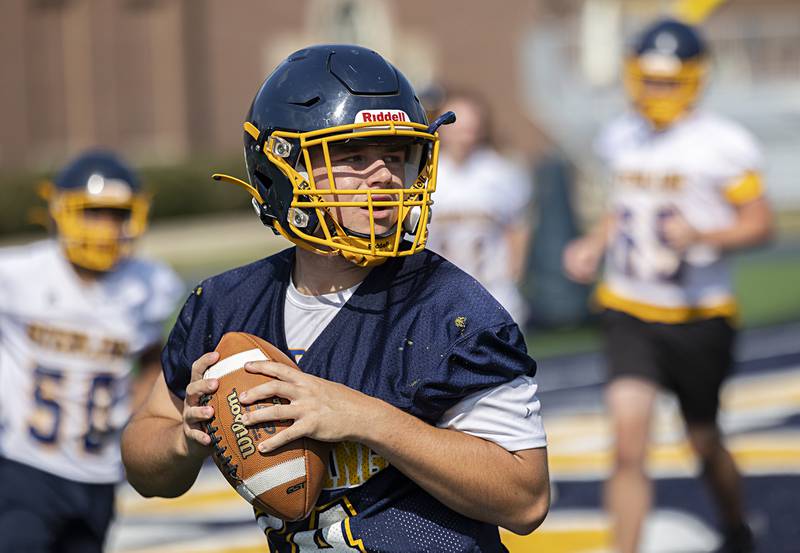 Sterling’s Drew Nettleton works on his footwork Tuesday, Aug. 13, 2024 during quarterback drills at Sterling High School.