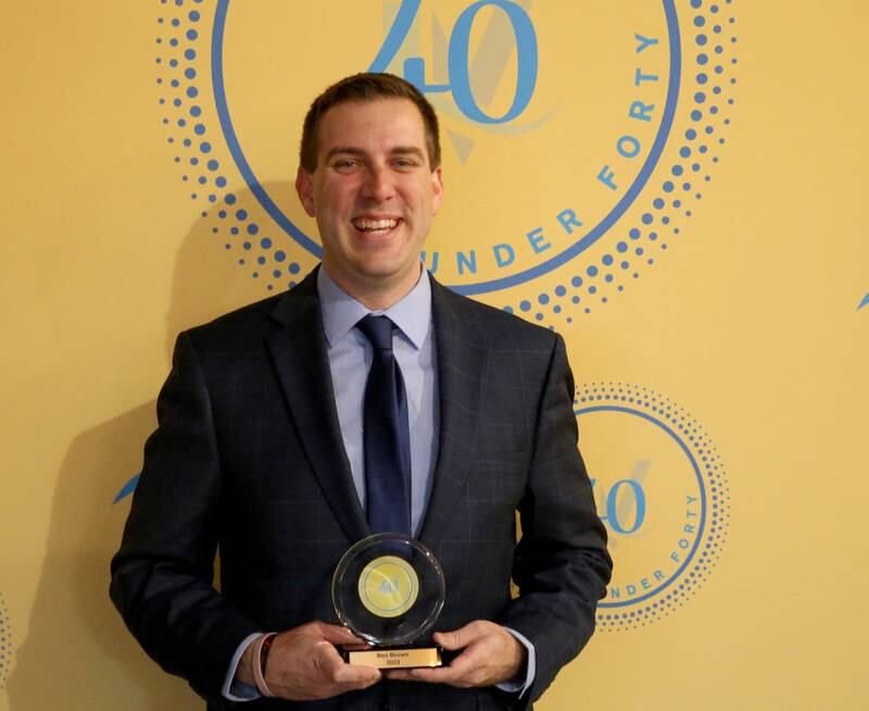 Ben Brown poses for a photo with his award during the 40 Under Forty awards banquet on Thursday, March 21, 2024 at Westclox in Peru.