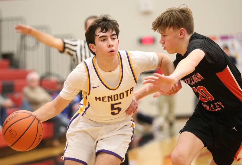 Mendota's Cameron Kelly gets around Stillman Valley's Ian Seper to sprint into the lane during the 49th annual Colmone Classic Tournament on Wednesday, Dec. 6, 2023 at Hall High School.