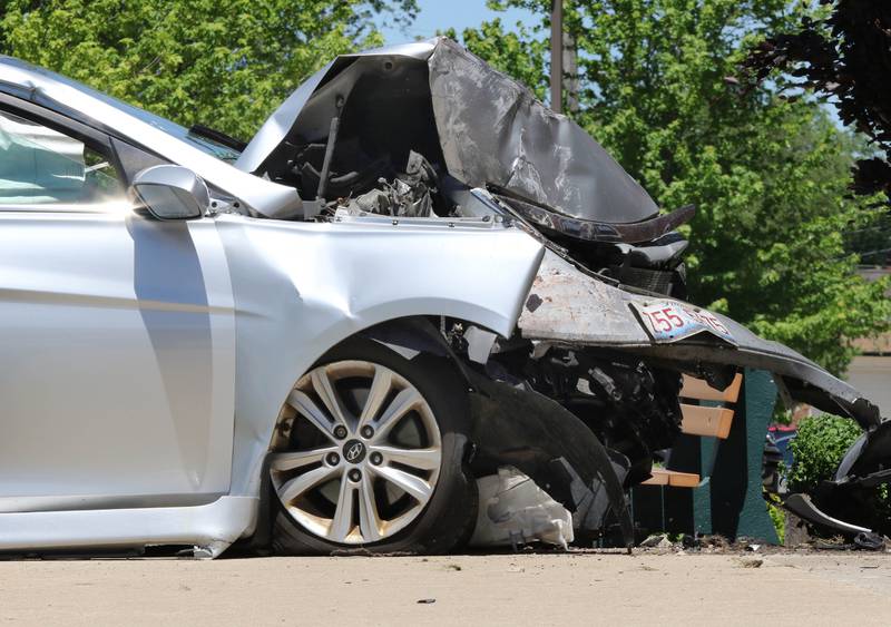 A car with heavy front end damage sits next to the front entrance of the Sycamore Police Department on DeKalb Avenue where it crashed into the building Wednesday morning, May 26, 2021. Police are investigating, and the cause of the crash remains unknown at this time. The crash sent the driver, a man, to Northwestern Medicine Kishwaukee Hospital with injuries.