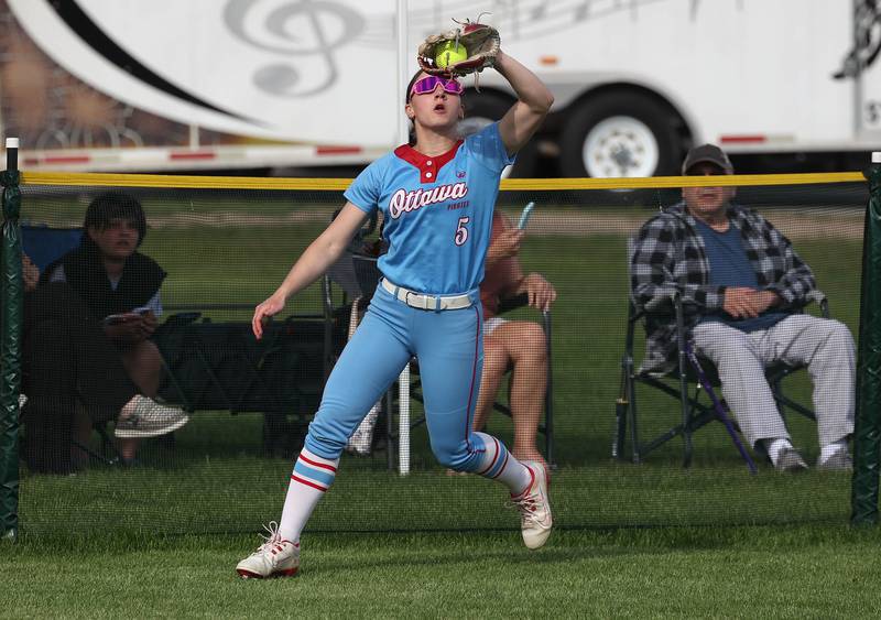 Ottawa's Avery Leigh makes a catch at the fence Monday, May 12, 2025, during their game at Sycamore High School.