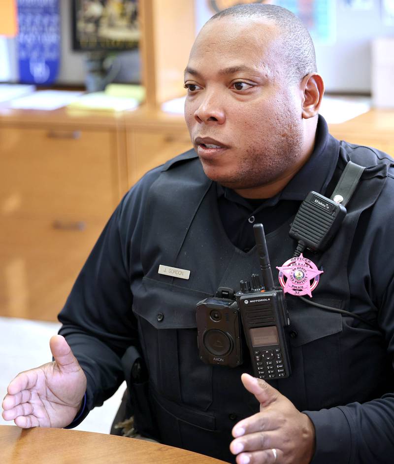 Josef Gordon, DeKalb Police officer and student resource officer at DeKalb High School, talks Thursday, Oct. 20, 2022, at the school, about what he enjoys most about working with students and some of the challenges that it can create.