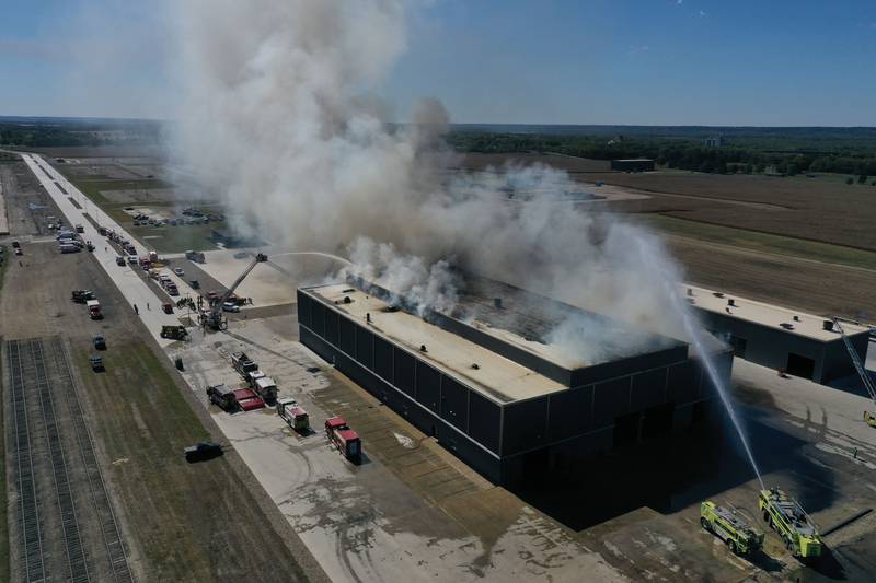 Smoke billows from Marquis Energy as firefighters work to control a structure fire on Wednesday, Oct. 8, 2025 in Hennepin. The fire was upgraded to a 5th alarm dispatching the (MABAS) Mutual Aid Box Alarm System. The fire broke out around 11a.m.