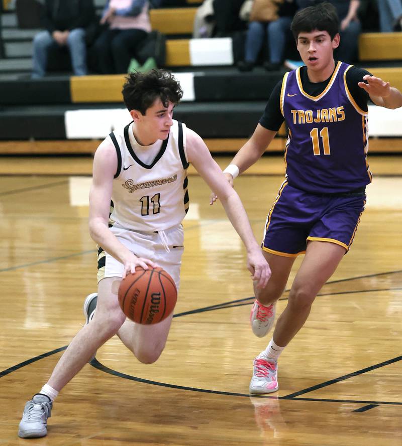 Sycamore's Jake Shipley gets around Mendota’s Izaiah Nanez during their game Wednesday, Dec. 13, 2023, at Sycamore High School.