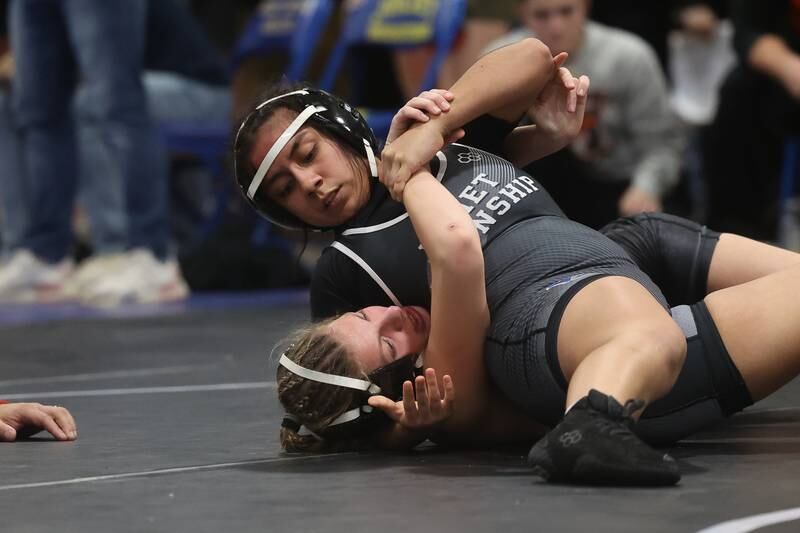 Joliet Township’s Isabel Barrera works over Minooka’s Eva Beck in the Southwest Prairie Conference 135 pound Championship at Joliet Central on Saturday, Jan. 20th, 2024.