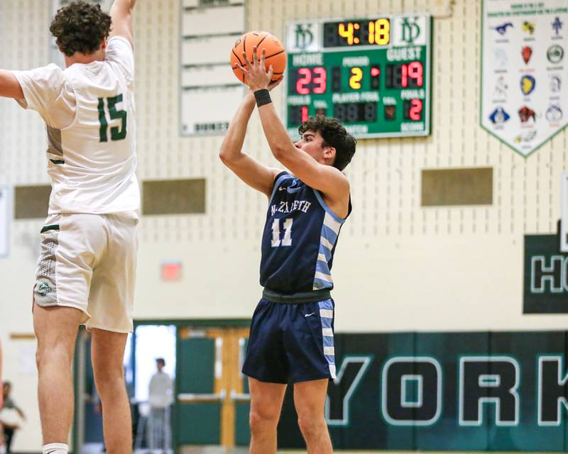 Nazareth's Oliver De santiago (11) shoots a jumper during their Jack Tosh Holiday Classic basketball tournament game between Nazareth vs Glenbard West. Thursday Dec 26, 2024 in Elmhurst.
