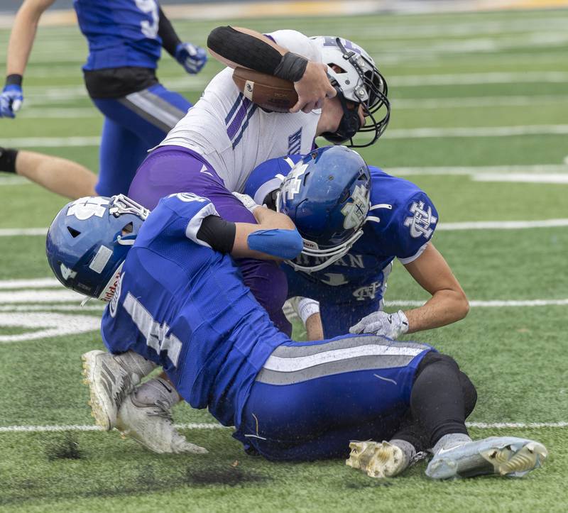 Ridgeview-Lexington’s Joe Cheever is tackled against Newman Saturday, Nov. 1, 2025, in round one of the Class 2A football playoffs.