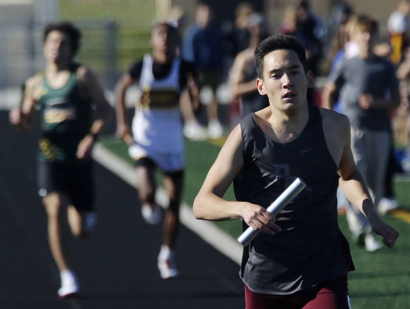 Prairie Ridge's Bodhi Lee runs the last leg of the 4x800 meter relay to get his team a second place finish in the relay during the IHSA Class 2A Richmond-Burton Sectional Boys Track and Field Meet on Wednesday, May 20, 2026, at Richmond-Burton High School.