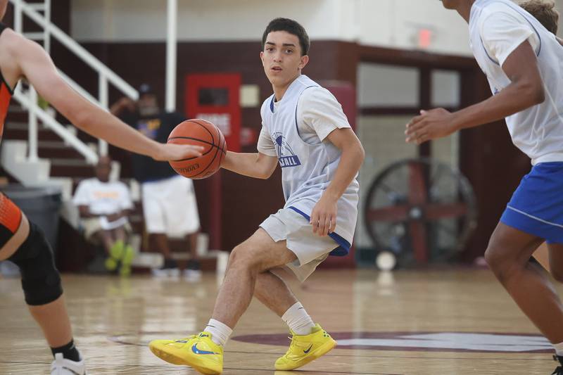 Joliet Central’s Jayden Poplawski looks for a play against DeKalb at the 37th Morris Boys Shootout on Tuesday, June 25, 2024.