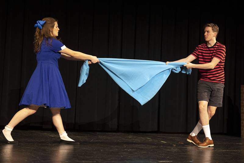 Gianna Sagel, playing the part of Lucy, fights over little brother Linus’ blanket, played by Ryan Welty, Tuesday, March 7, 2023. Performances will be March 9, 10 and 11 at 7 pm and March 12 at 2 pm at the Jerry Mathis Theatre at Sauk Valley College.