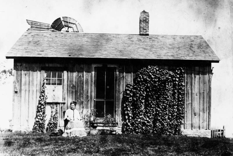 Harriet Cooney Cherry sits outside her small house on one of the Cherry farms south of Oswego in NaAuSay Township. One of the Cherry family farms will be a stop on the Oswegoland Heritage Association’s “Oswego History Tour — Legacy Farms” on Saturday, Sept. 24.