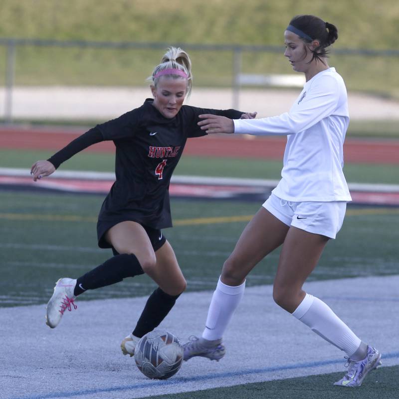 Huntley's Brooke Maxedon battles with Crystal Lake Central's Ella Bechler for control of the ball during a Fox Valley Conference  soccer match on Tuesday, April 15, 2025, at Huntley High School.