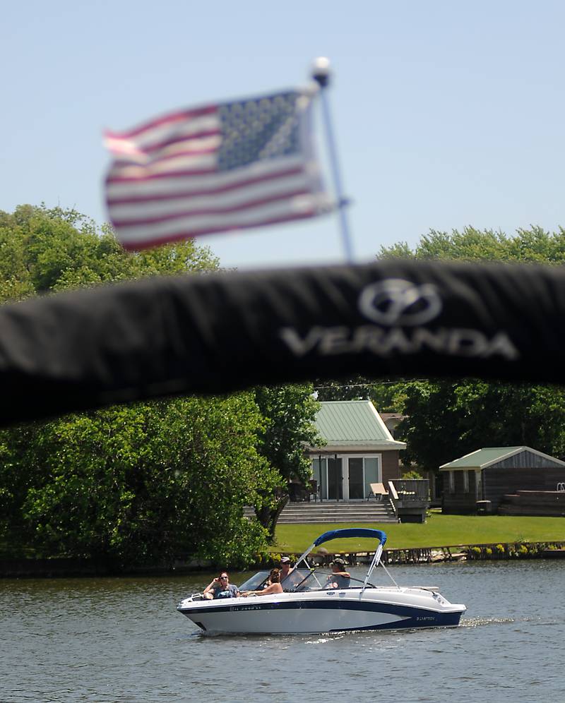 Boaters cruise the Fox River on Tuesday, June 14, 2022, in McHenry, as temperatures in the McHenry County area reached the mid-90’s.
