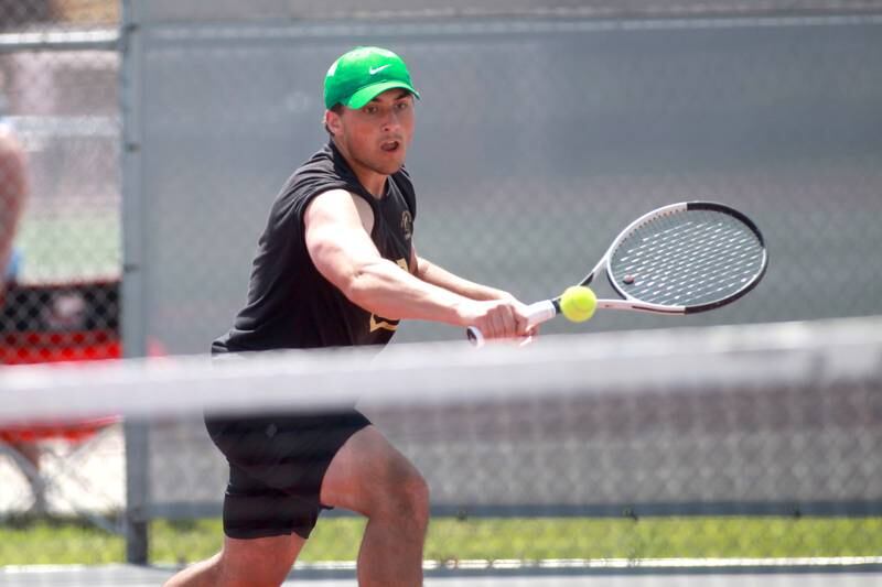 Sycamore’s Joe Culotta returns the ball during a doubles match with partner Jonathan Locascio (not pictured) in the state championship preliminaries at Palatine High School on Thursday, May 23, 2024.