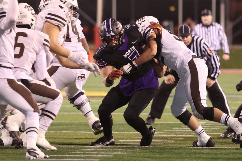 Downers Grove North’s Cael Brezina works out of a block against Mt. Carmel in the Class 7A championship on Saturday, Nov. 25, 2023 at Hancock Stadium in Normal.