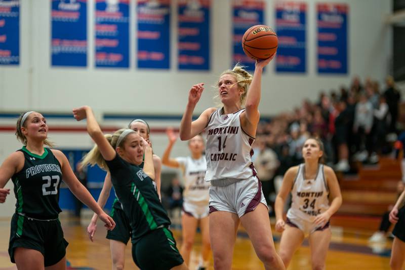 Montini’s Shannon Blacher (14) shoots the ball in the post against Providence during the 3A Glenbard South Sectional basketball final at Glenbard South High School in Glen Ellyn on Thursday, Feb 23, 2023.