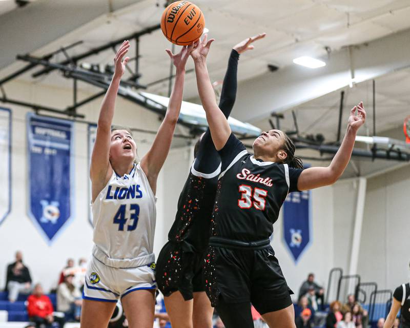 Lyon's Emma O"brien (43) battles for a rebound during their Coach Kipp's Hoopfest basketball game between Lyons at St Charles East. Jan 18, 2025 in La Grange.