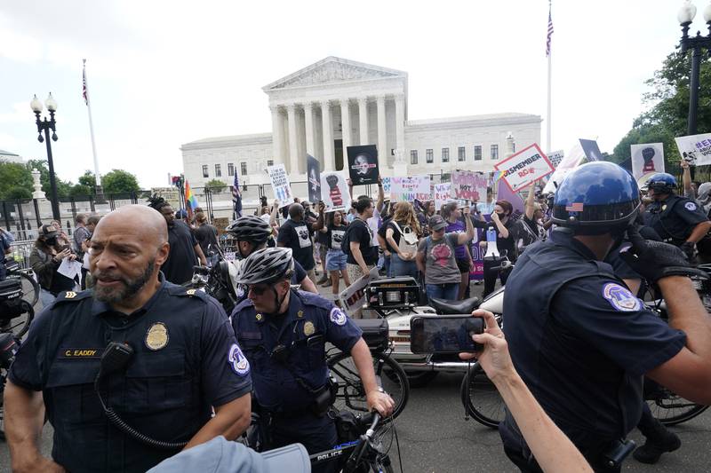 People protest about abortion, Friday, June 24, 2022, outside the Supreme Court in Washington. (AP Photo/Steve Helber)