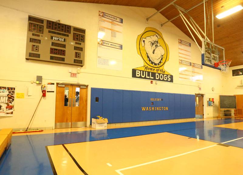 Air condition is coming to Washington School in Oglesby. A view of the gymnasium shows the scoreboard and "Home of the Bulldogs logo on Monday Jan. 24, 2022. New HVAC ventilation and kitchen equipment will be installed beginning in May at the conclusion of the school year. Work will involve installing air ducts in the ceiling of the gymnasium, classrooms, hallways, and kitchen. The project will not increase the tax rate. Reserves and federal grand dollars will help pay for the project. The building was built in 1957. Construction is scheduled to be completed in late August just as students return.