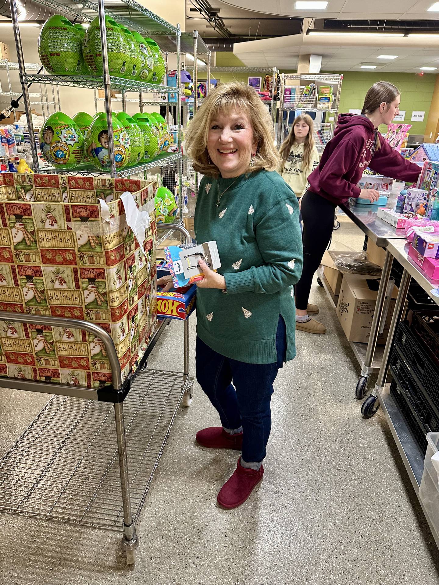 Genoa-Kingston School District 424 human resources employee and district toy drive organizer Christi Volkening poses during a Dec. 18, 2024, district toy drive.
