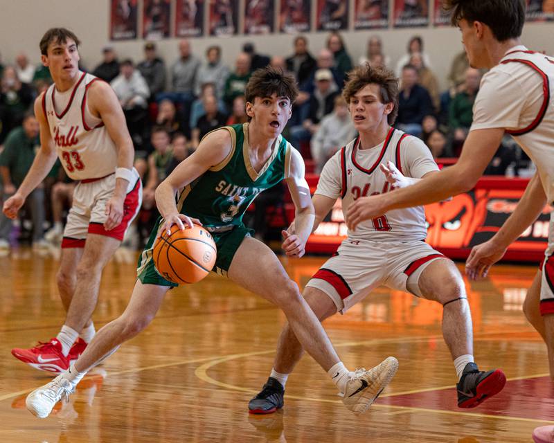 St. Bede's Alec Tomsha (3) reacts as he dribbles ball down court whilst being guarded by Hall's Greyson Bickett (0) on Saturday, January 31, 2026 at Hall High School in Spring Valley.