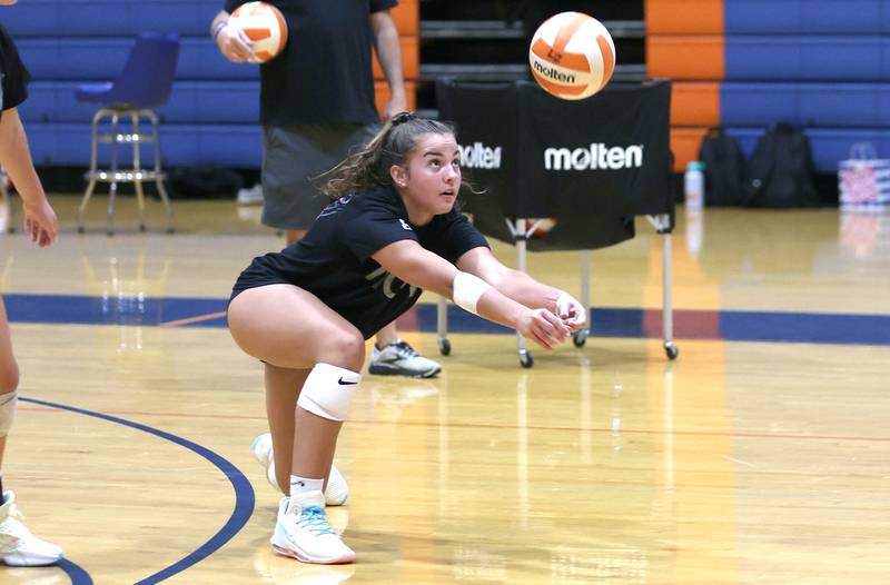 Genoa-Kingston's Alivia Keegan digs a ball Tuesday, Aug. 23, 2022, during volleyball practice at the school in Genoa.
