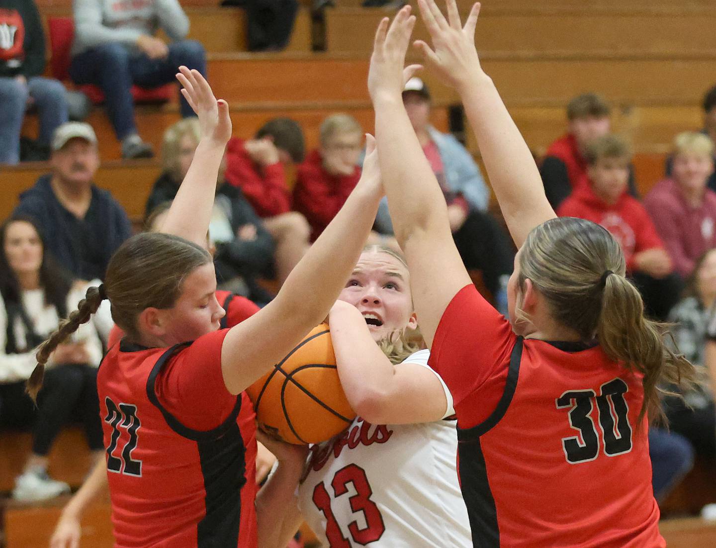 Hall's Caroline Morris, is surrounded by Stark County defenders Abby Nagode, and Adelynn Gibson during the Tiger Girls Basketball Holiday Tournament on Tuesday, Nov. 18, 2025 at Princeton High School.