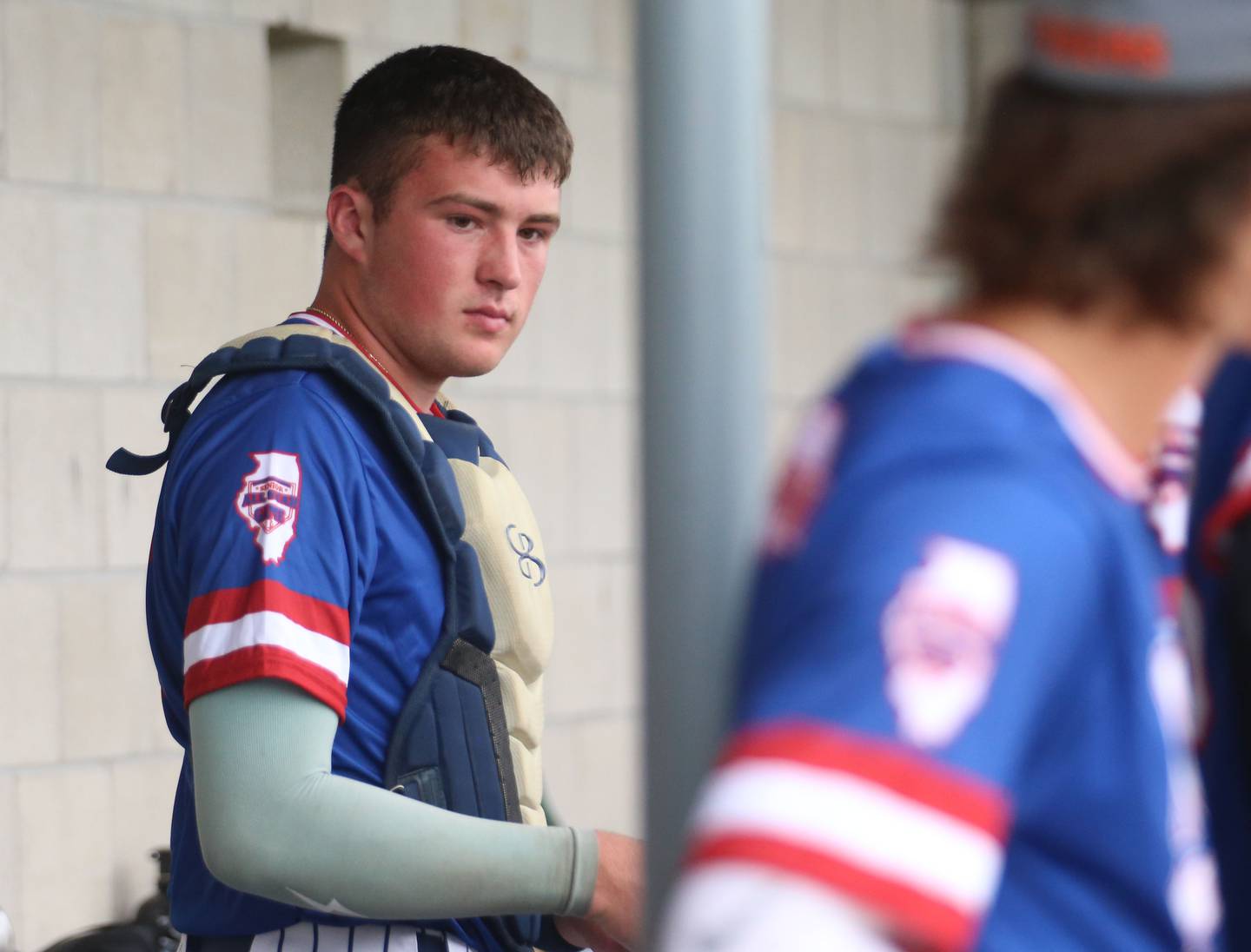 Marquette's Keaton Davis grabs his catcher gear during the ICA Senior Baseball All Star Game on Monday, June 30, 2025 at Schweickert Stadium in Peru.
