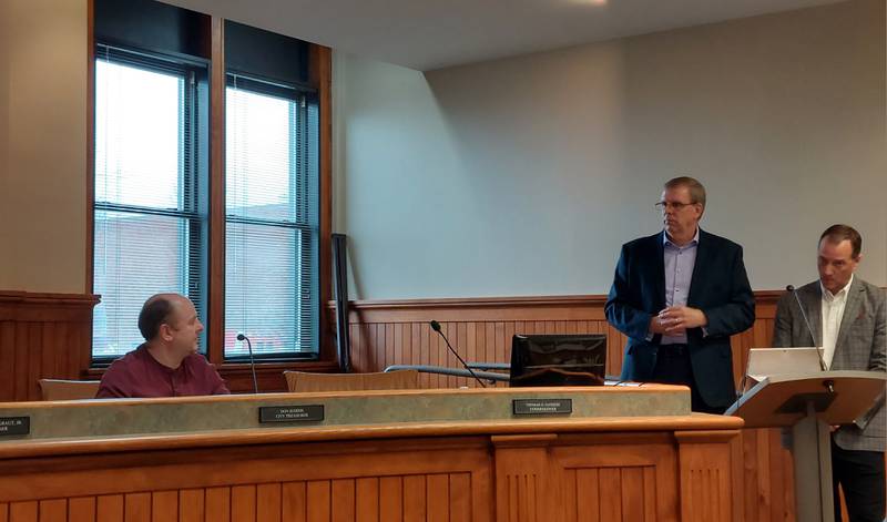 Consultants Dan Anderson (left) and David Slivinski from the Illinois Fire Chiefs Association speak Thursday, Dec. 28, to the Ottawa City Council during a town hall meeting about the placement of a third fire station within the city.