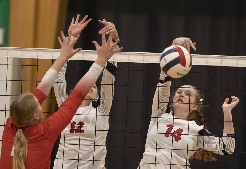 Erie-Prophetstown’s Eden Jensen stuff a shot over the net against Oregon Tuesday, Oct. 28, 2025, in the Class 2A regional semifinal at Rock Falls.