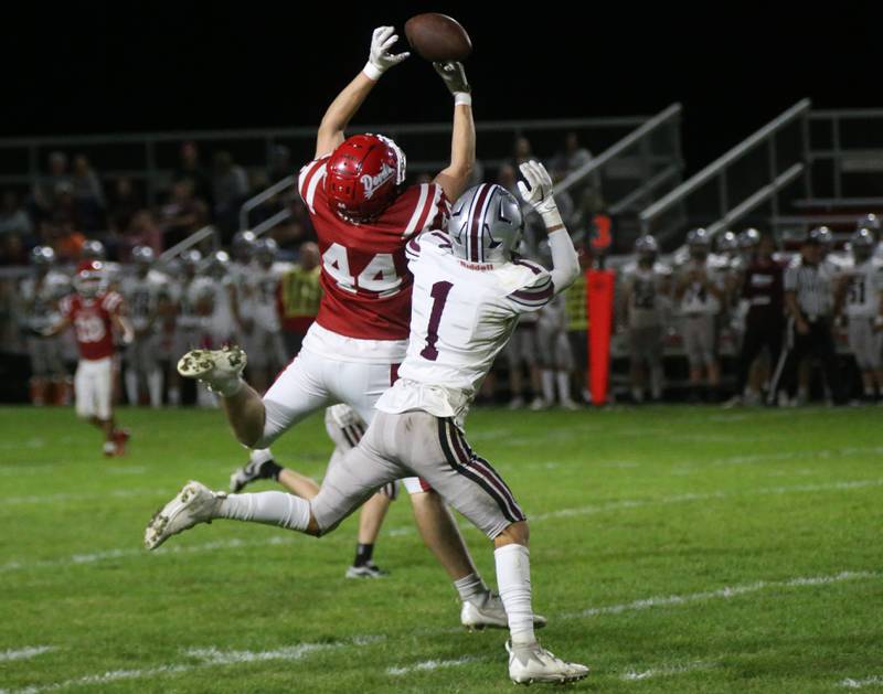 Hall's Evan Stefaniak makes a catch over Illinois Valley Central's Ryan Adler on Friday, Sept. 29, 2023 at Richard Nesti Stadium.