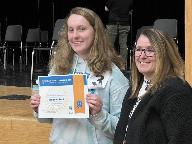 Somonauk Middle Schooler Brighid Reid won the DeKalb County Regional Office of Education Spelling Bee on Feb. 22, 2025. DeKalb County Regional Office of Education assistant superintendent Carmen Siragusa presented Reid with a certificate for her accomplishment.